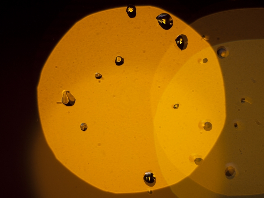 [Image: Raindrops by @jjphoto - Rain drops on my office window at night against a street light. on Propic]