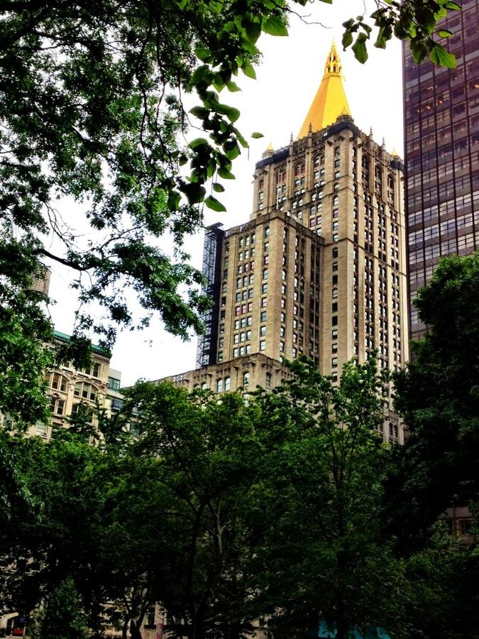 [Image: Gold Leafs! by @LordOfVisions - 25,000 Gold leaf tiles sit atop of the New York Life building! on Propic]