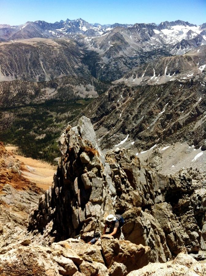 [Image: Image by @shawnreeder - Sitting on the summit of Mt Emerson w/  great friends. Here's @YosemiteSteve climbing up the ridge below the summit on Propic]